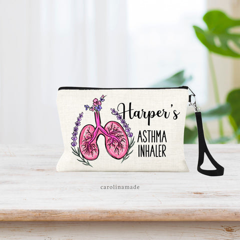 This linen zipper pouch features a set of lungs with flowers and greenery around it. Next to the art it says a personalized name and Asthma Inhaler.