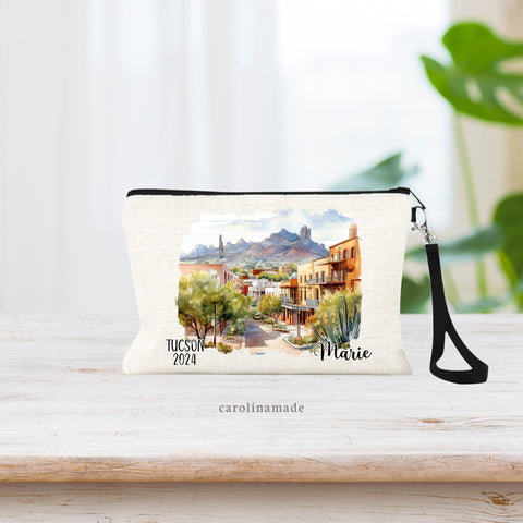 Watercolor Tucson Arizona Dessert Town scenery in the center of the bag. The right corner is personalized with your name. The left corner says Tucson and the current year.