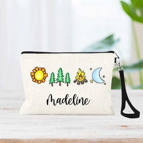 This linen zipper pouch features a minimalist design with sun, trees, campfire and moon and stars. It is personalized at the bottom. Perfect camping gear for boys and girls summer camp.