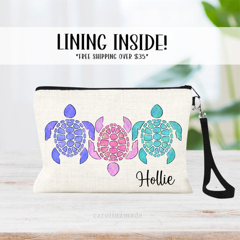 This linen zipper pouch features 3 watercolor colorful vibrant sea turtles in a row and is personalized with your name on the bottom corner.